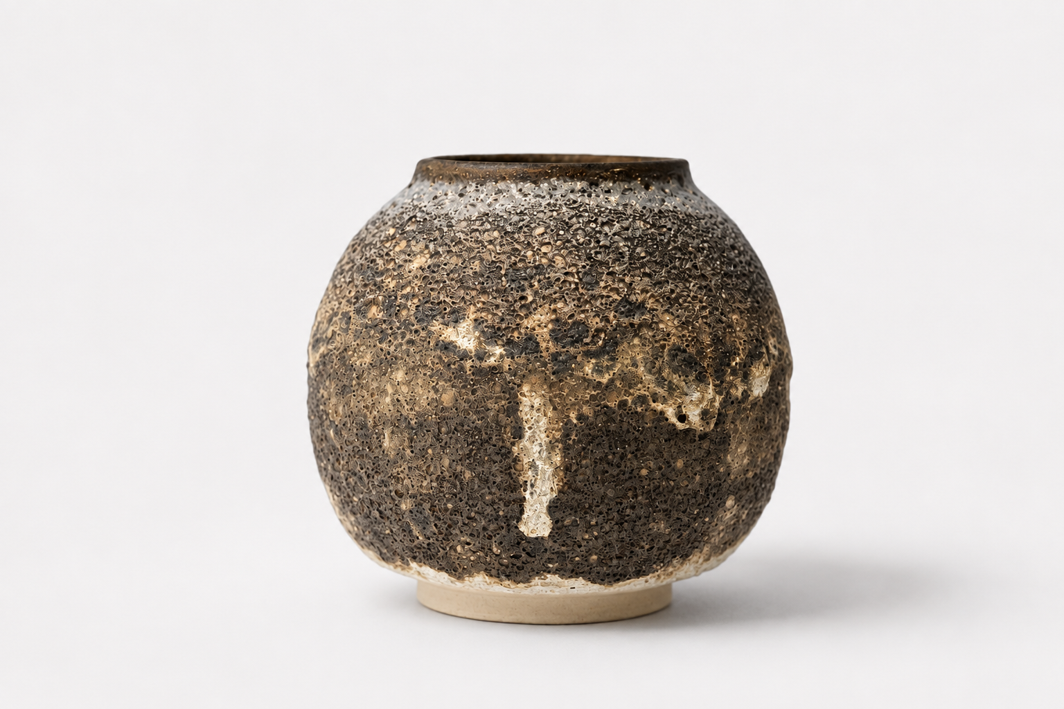 Rounded Moon Jar with a dark bronze volcanic surface