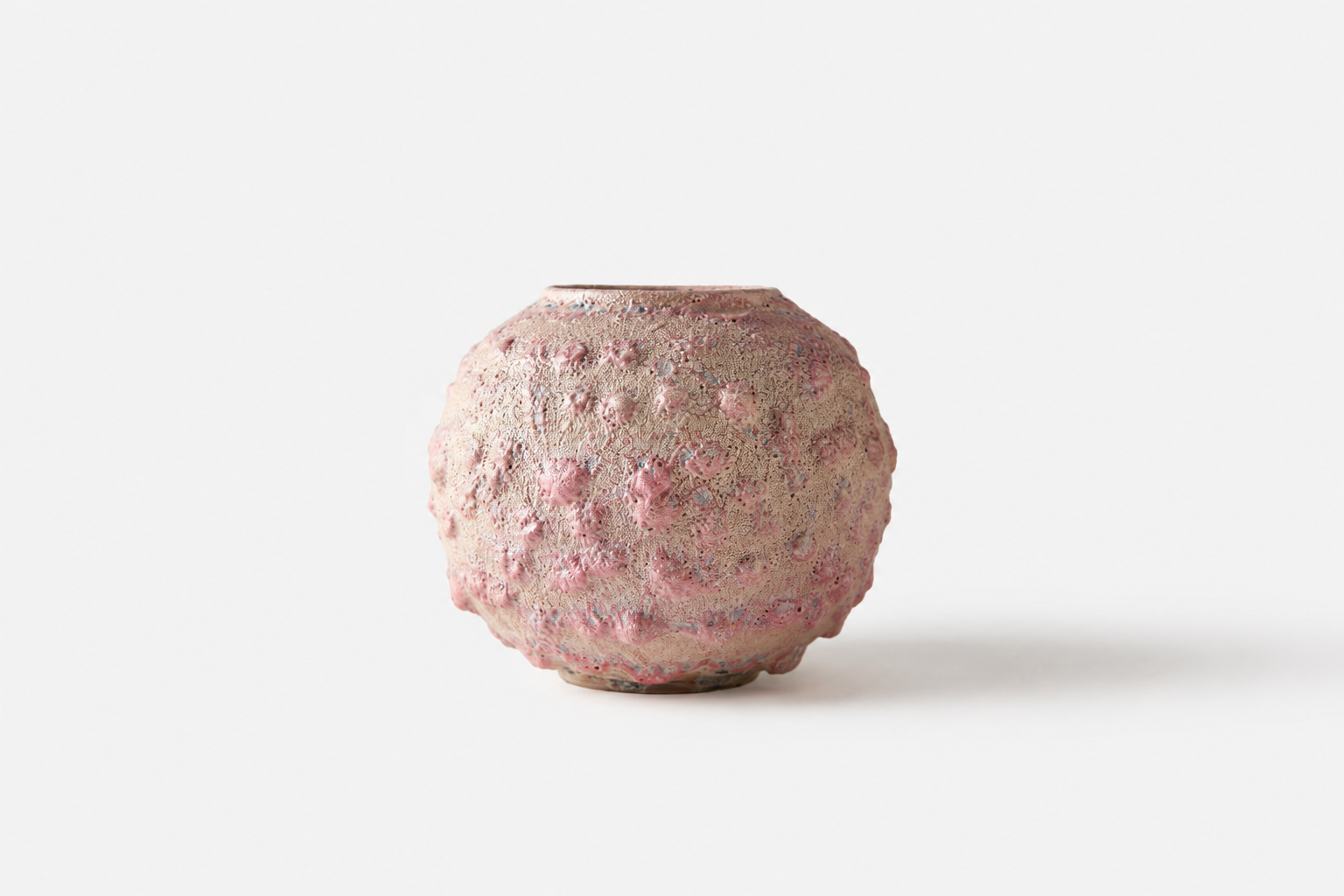 Small rounded Moon Jar with a textured pink surface