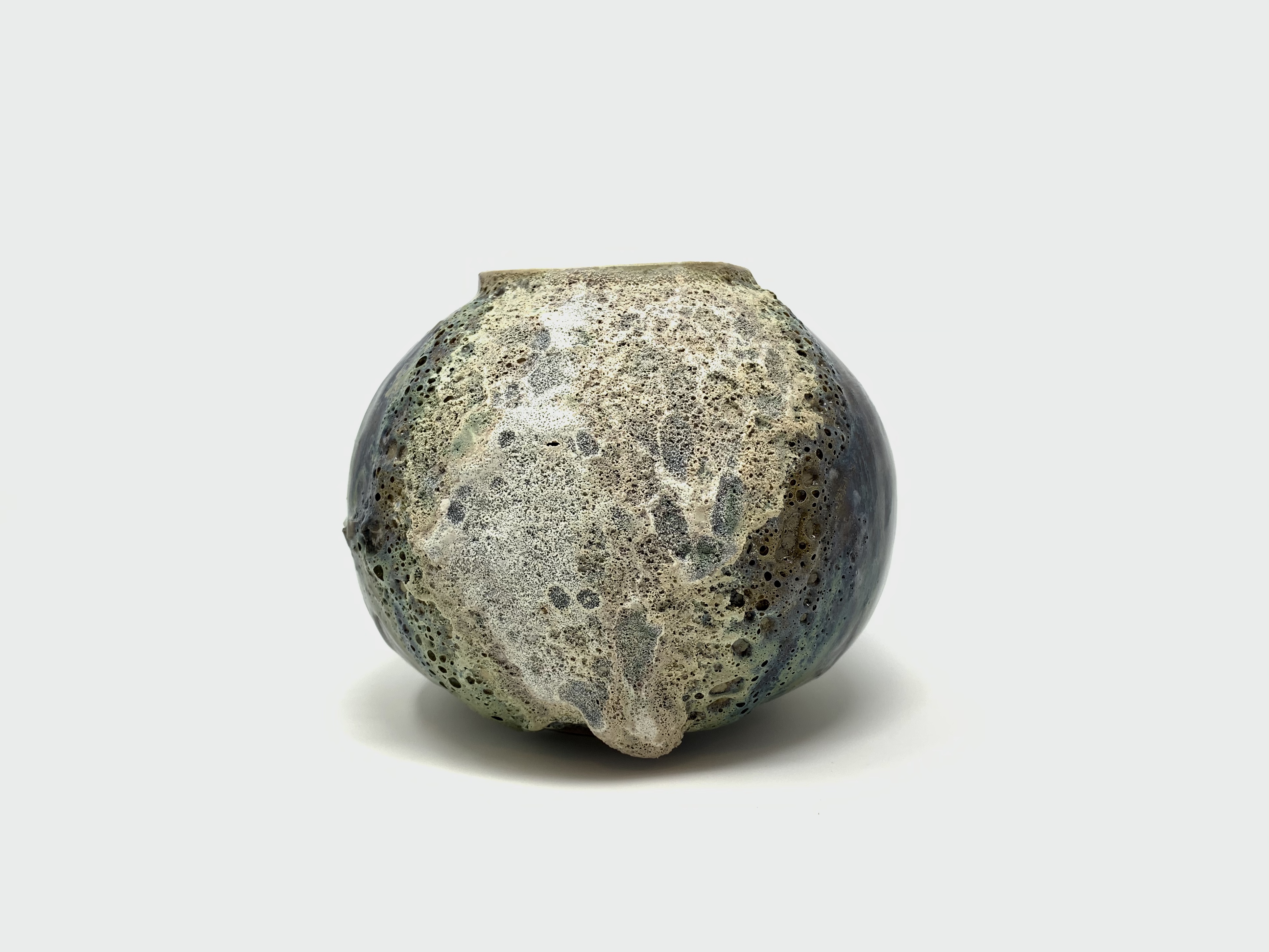 Rounded Moon Jar with an irregular pale and dark volcanic surface