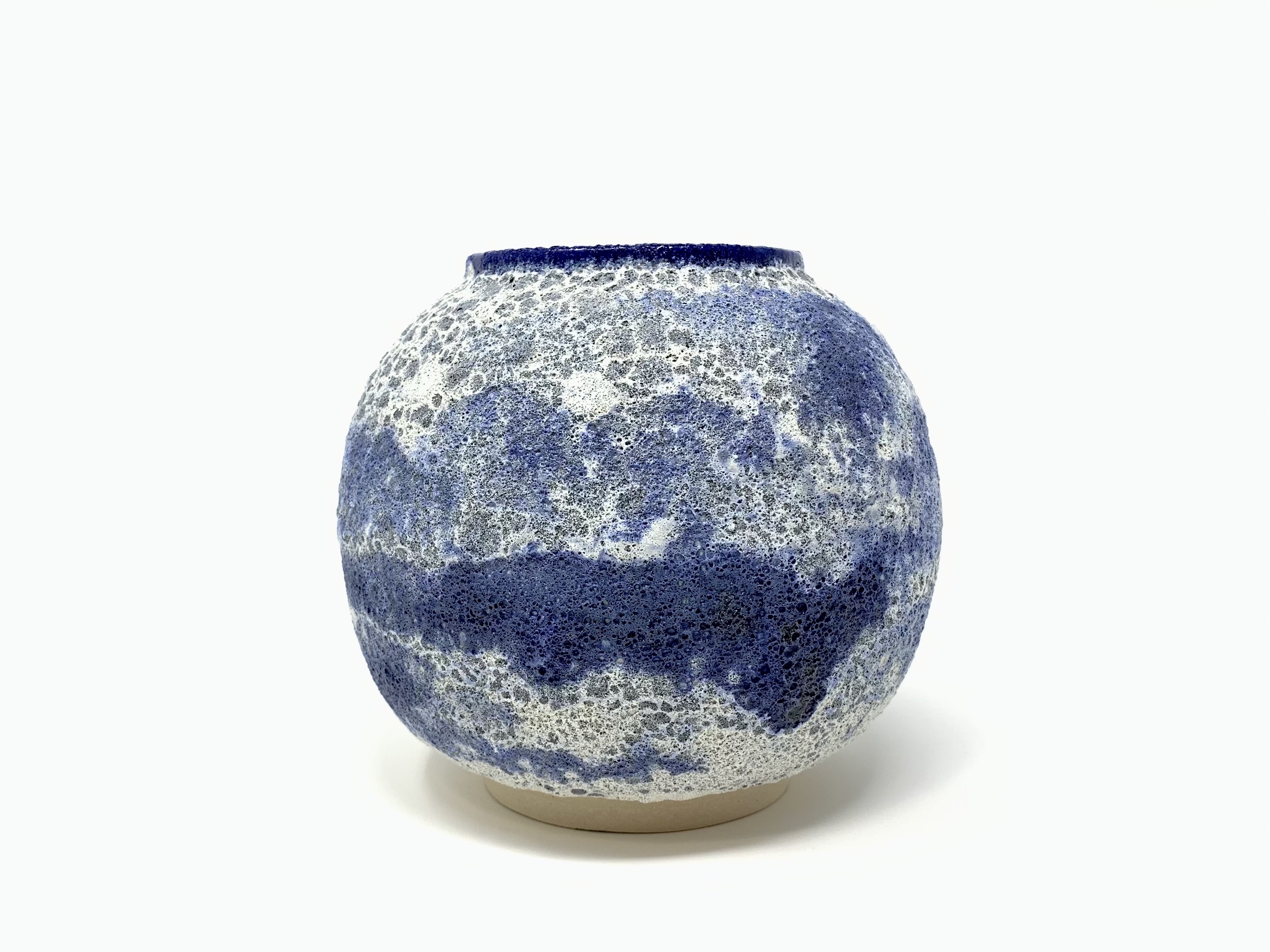 Blue and white Moon Jar with a layered volcanic glaze