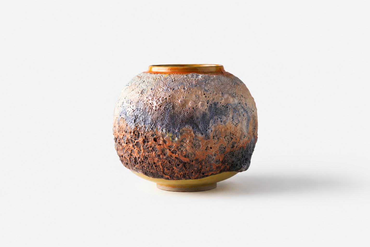 Small rounded Moon Jar with textured orange and charcoal glazes