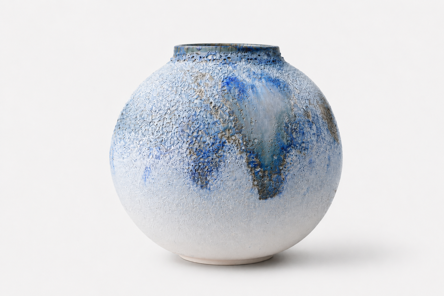 Pale blue and white Moon Jar with flowing glaze details