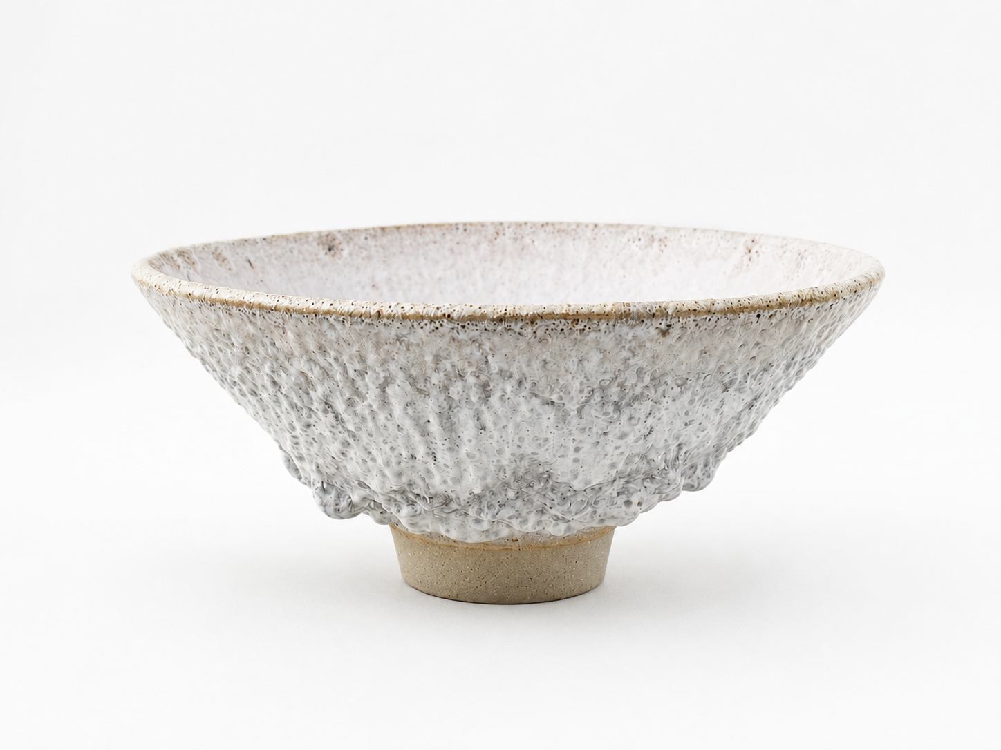 Wide white V-shaped bowl with a deeply textured surface